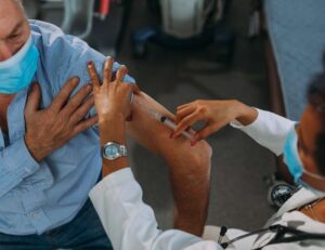 Older person receiving a vaccination