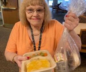 Recipient of home-delivered meal from Scott Carver Dakota CAP Agency.