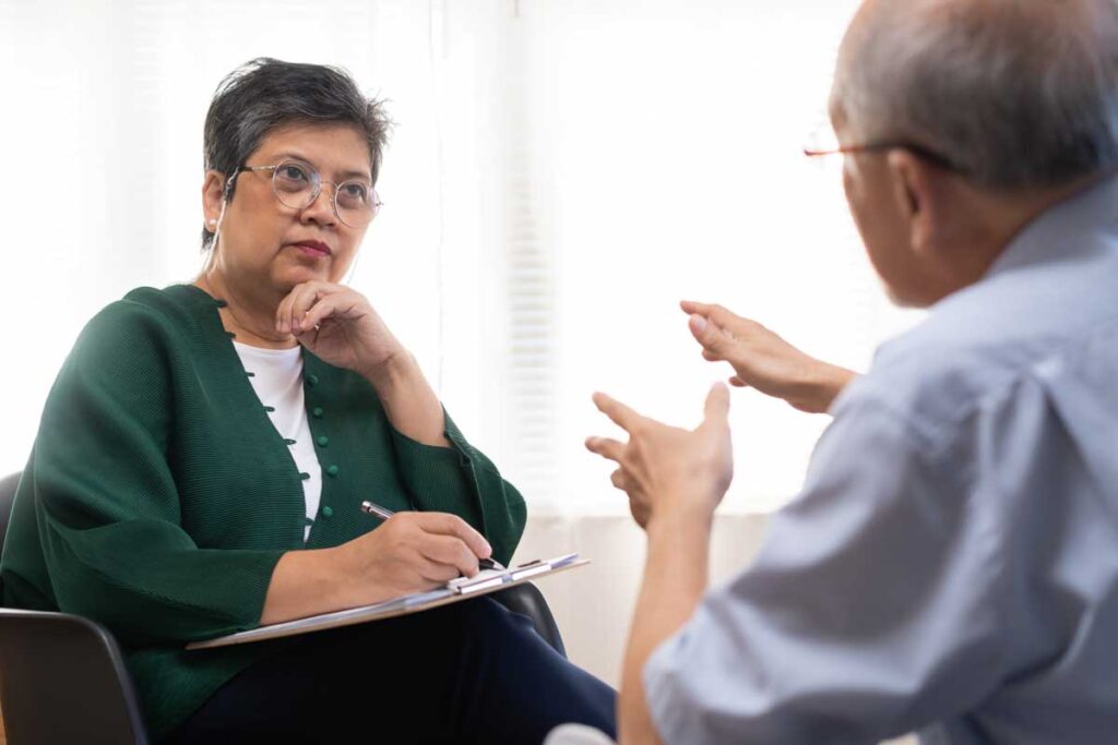 A woman attorney talking with a pension and retirement rights client