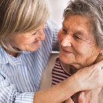 Two people embracing and smiling