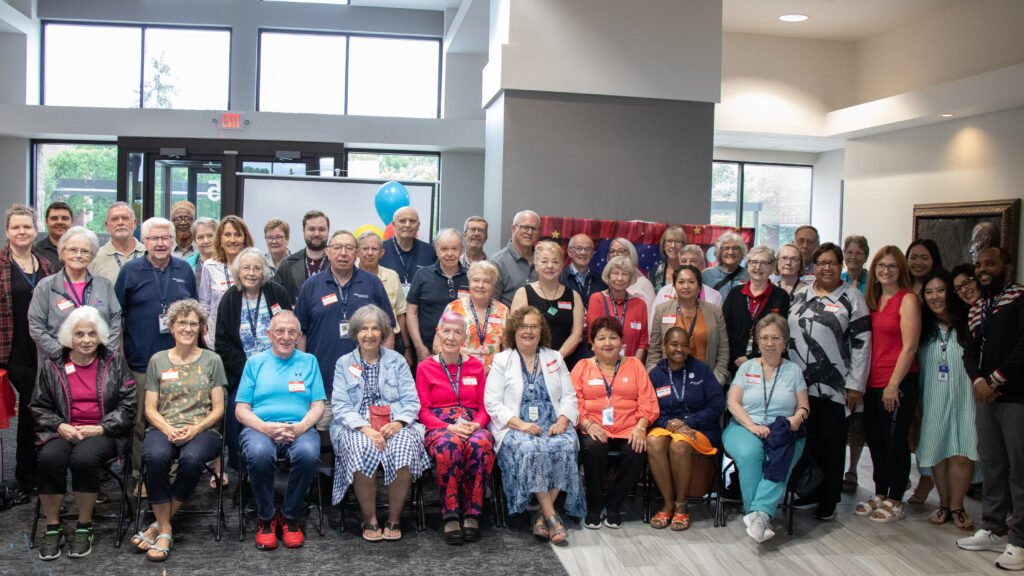 Wide-angle photo of a large group of Trellis volunteers.